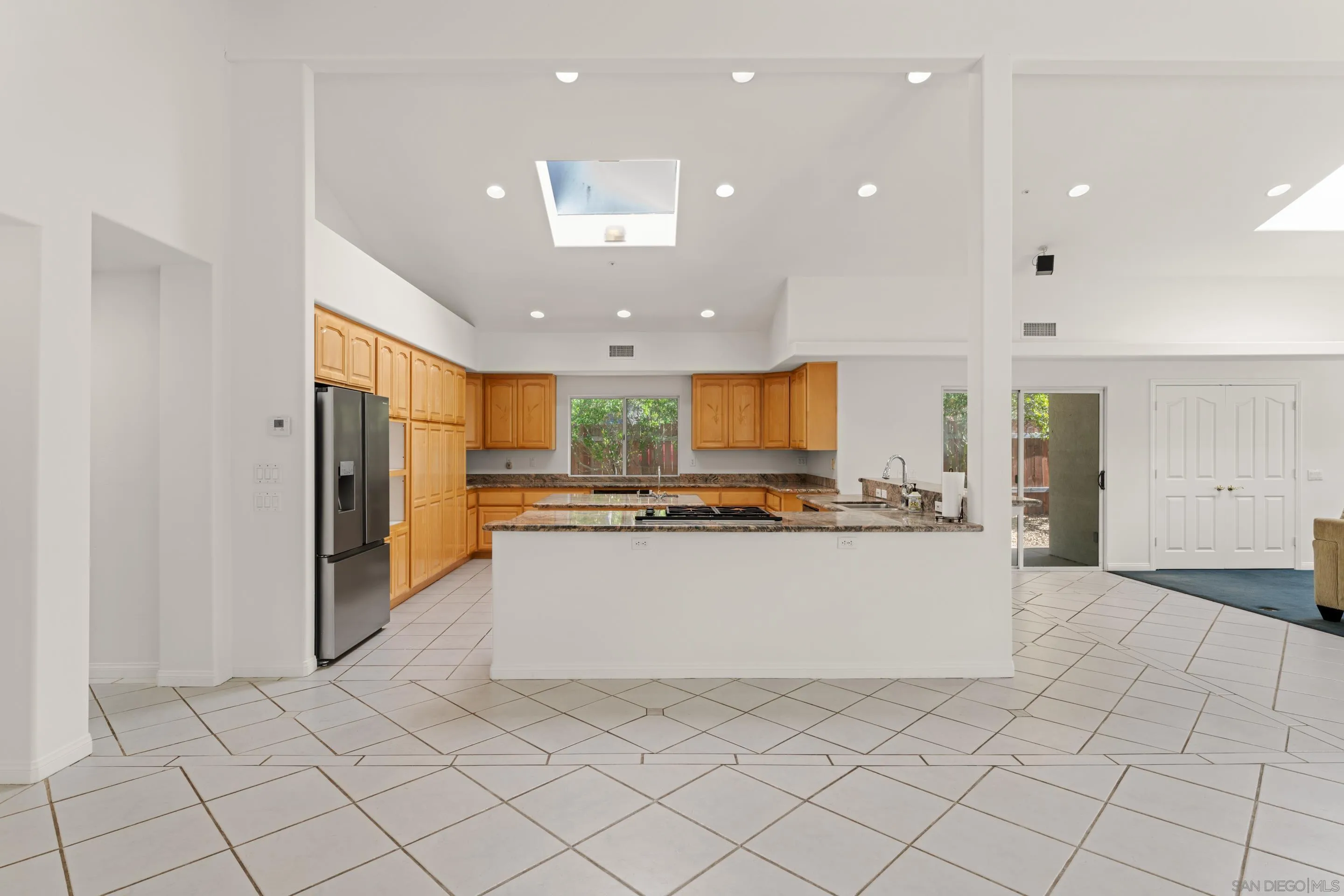 16611 Orchard Bend Road Poway, CA 92064 - Photo 6 of 59 a view of kitchen with stainless steel appliances furniture refrigerator and cabinets