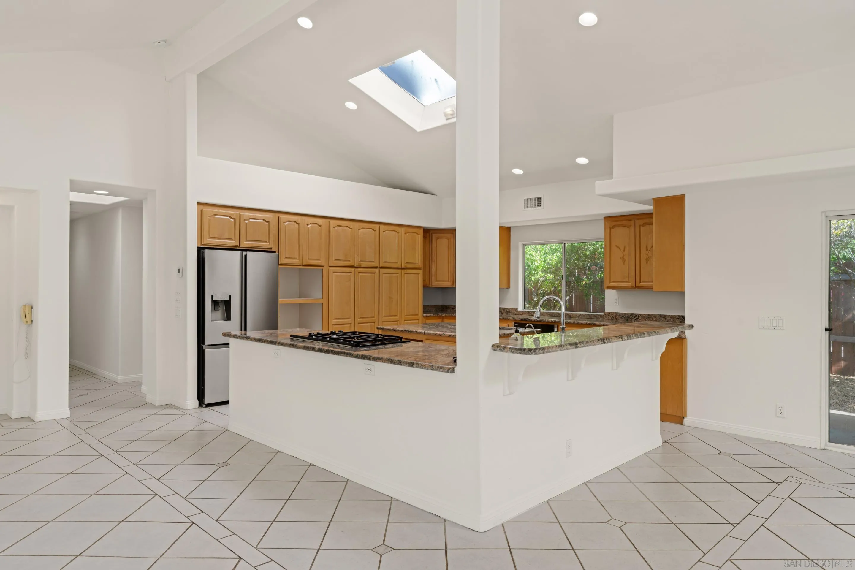 16611 Orchard Bend Road Poway, CA 92064 - Photo 8 of 59 a kitchen with stainless steel appliances granite countertop a refrigerator and a stove