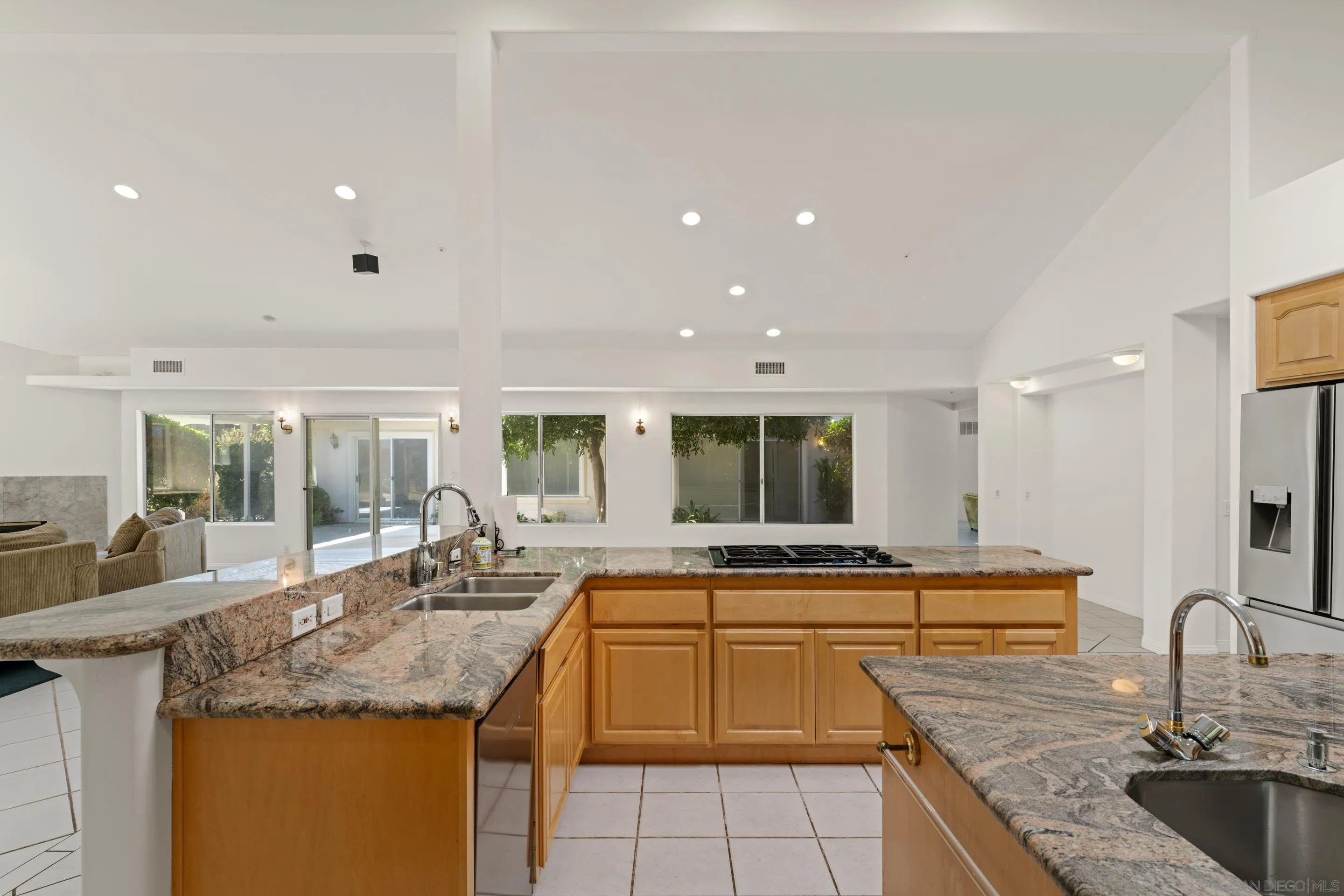 16611 Orchard Bend Road Poway, CA 92064 - Photo 10 of 59 a kitchen with granite countertop a sink and cabinets
