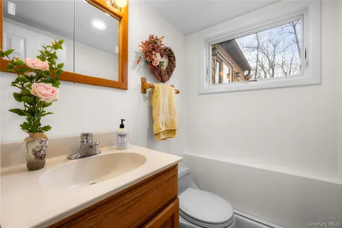 a living room with furniture gym equipment and a flat screen tv