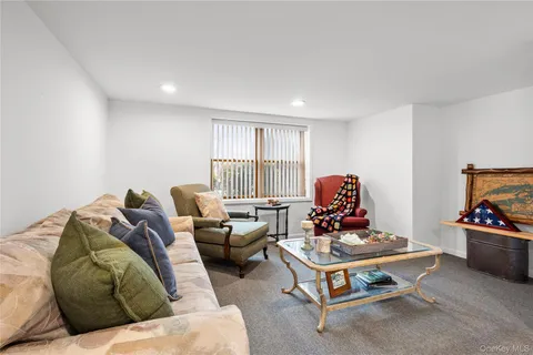 a living room with furniture window and a window