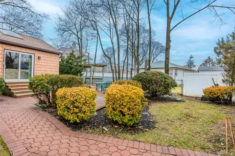 a view of a house with a bench
