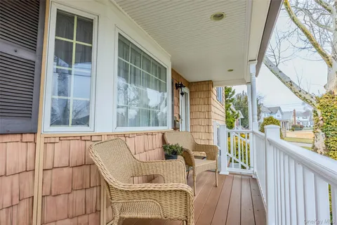 a view of a balcony with furniture