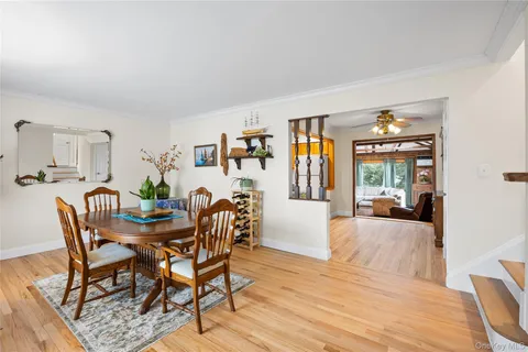 a view of a workspace with furniture and chandelier