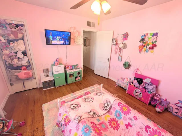 a bedroom with a bed and a couch