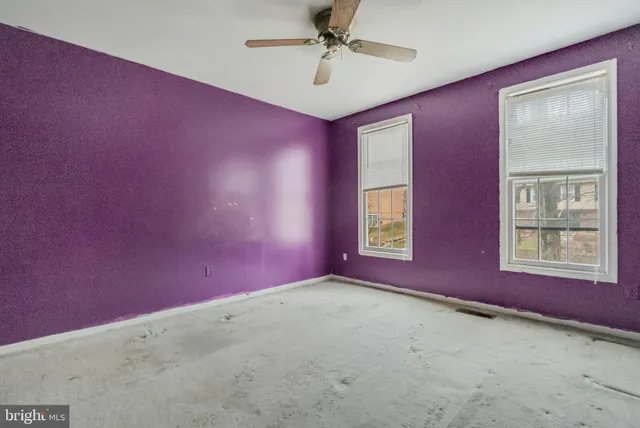 a view of a livingroom with an empty space and window