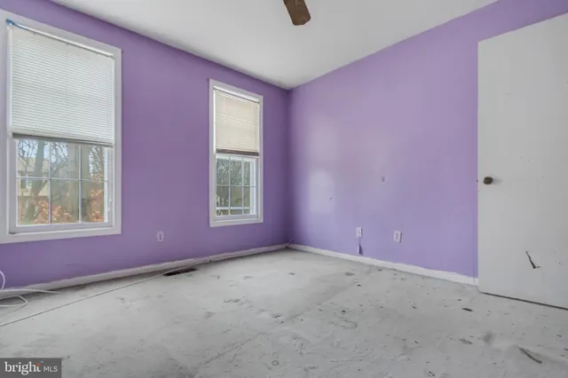 an empty room with windows