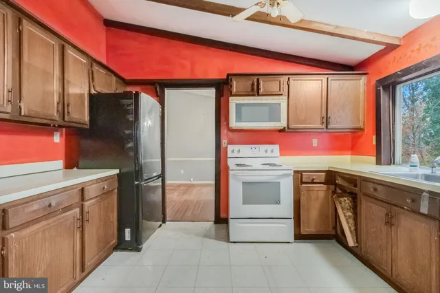 a kitchen with stainless steel appliances granite countertop a stove and a sink