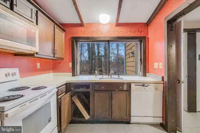 a kitchen with a stove and a microwave