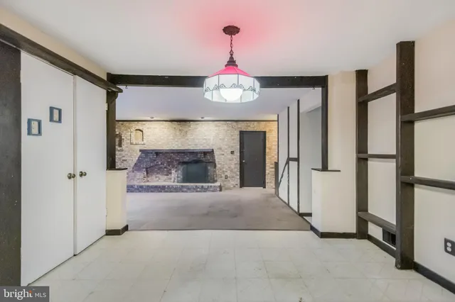 a en suite bathroom with a granite countertop sink and a mirror
