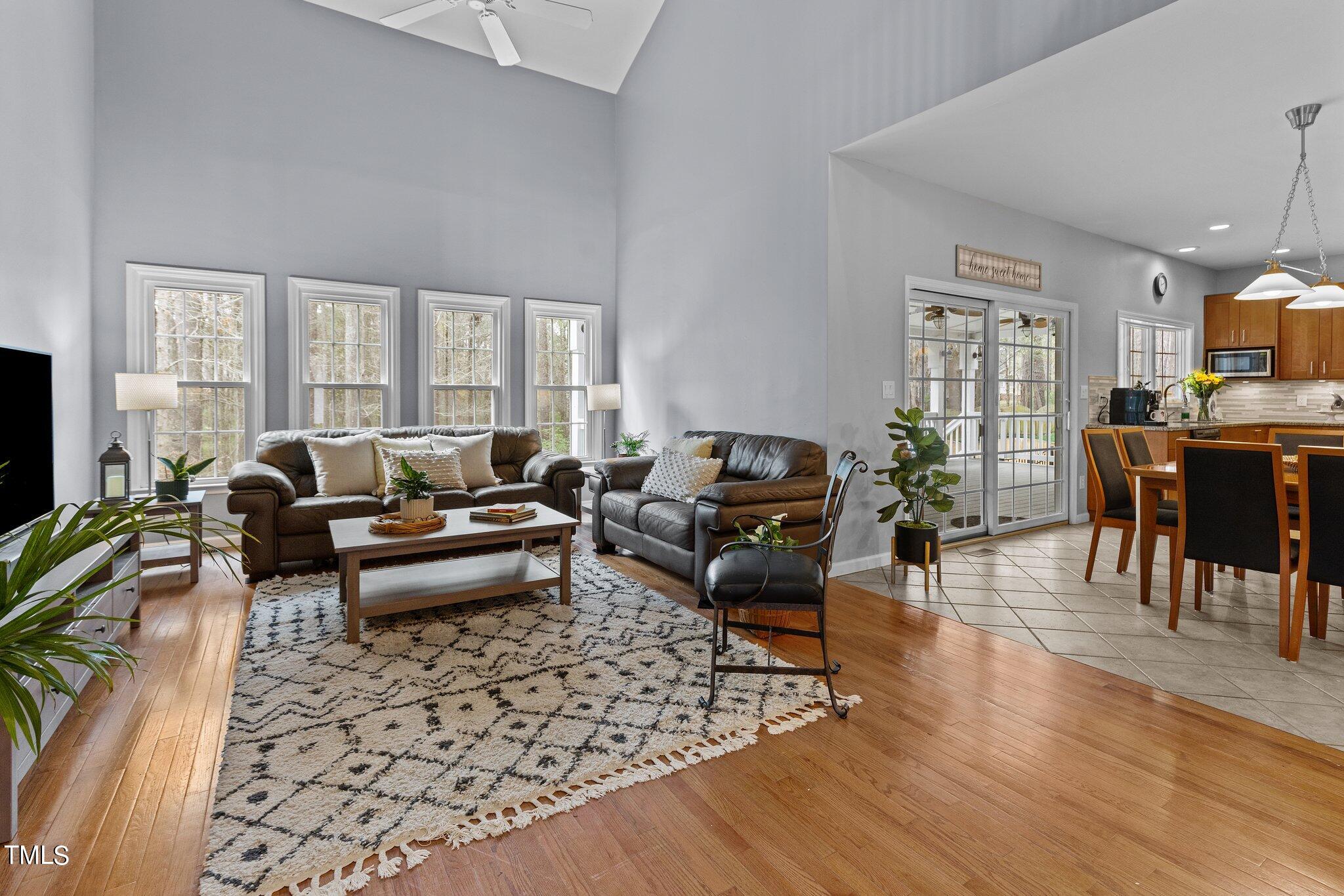 103 Summerglow Court Cary, NC 27513 - Photo 12 of 67 a living room with furniture or couch and a flat screen tv