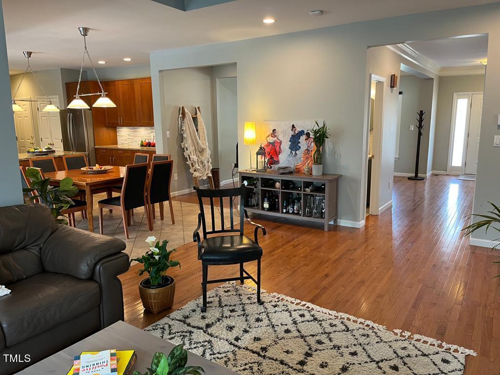 103 Summerglow Court Cary, NC 27513 - Photo 17 of 67 a living room with furniture and wooden floor