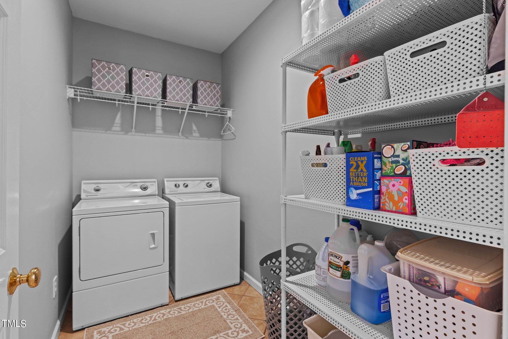 103 Summerglow Court Cary, NC 27513 - Photo 25 of 67 a utility room with dryer and washer