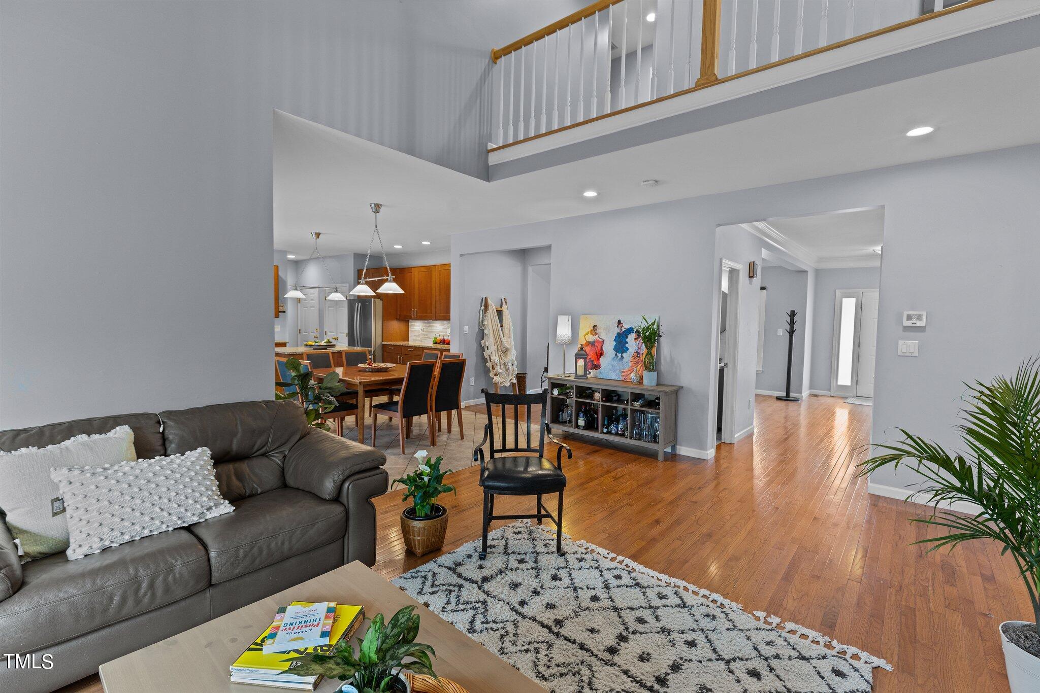 103 Summerglow Court Cary, NC 27513 - Photo 26 of 67 a living room with furniture and a wooden floor