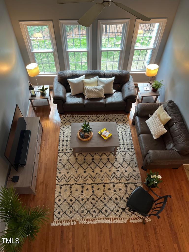 103 Summerglow Court Cary, NC 27513 - Photo 27 of 67 a living room with furniture and a flat screen tv