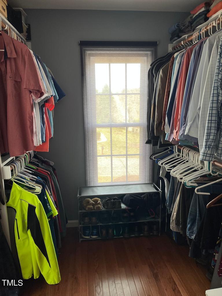 103 Summerglow Court Cary, NC 27513 - Photo 33 of 67 a view of walk in closet with clothes and shoes