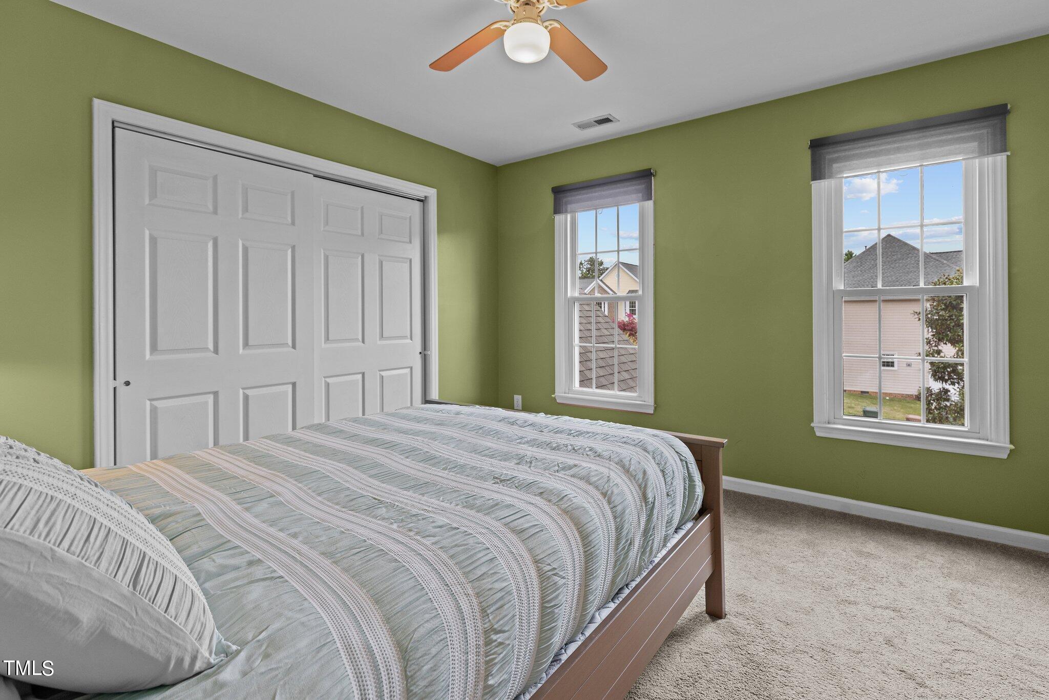 103 Summerglow Court Cary, NC 27513 - Photo 35 of 67 a bedroom with a bed and a window