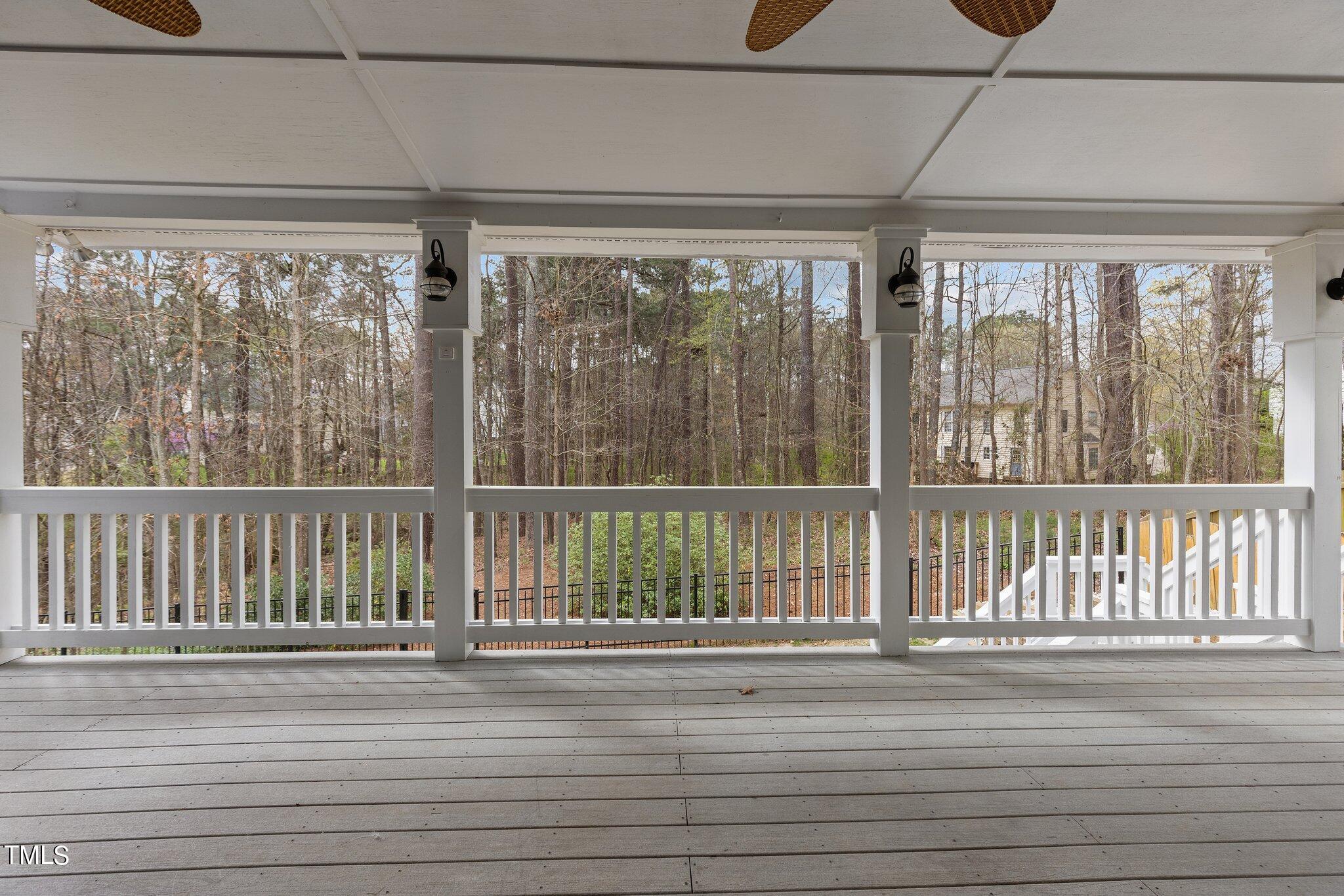 103 Summerglow Court Cary, NC 27513 - Photo 47 of 67 a view of a balcony with wooden floor