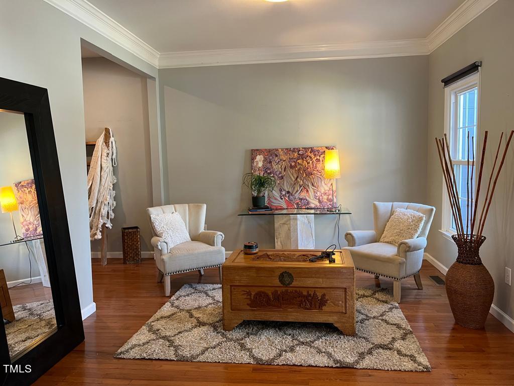 103 Summerglow Court Cary, NC 27513 - Photo 8 of 67 a living room with furniture and a flat screen tv
