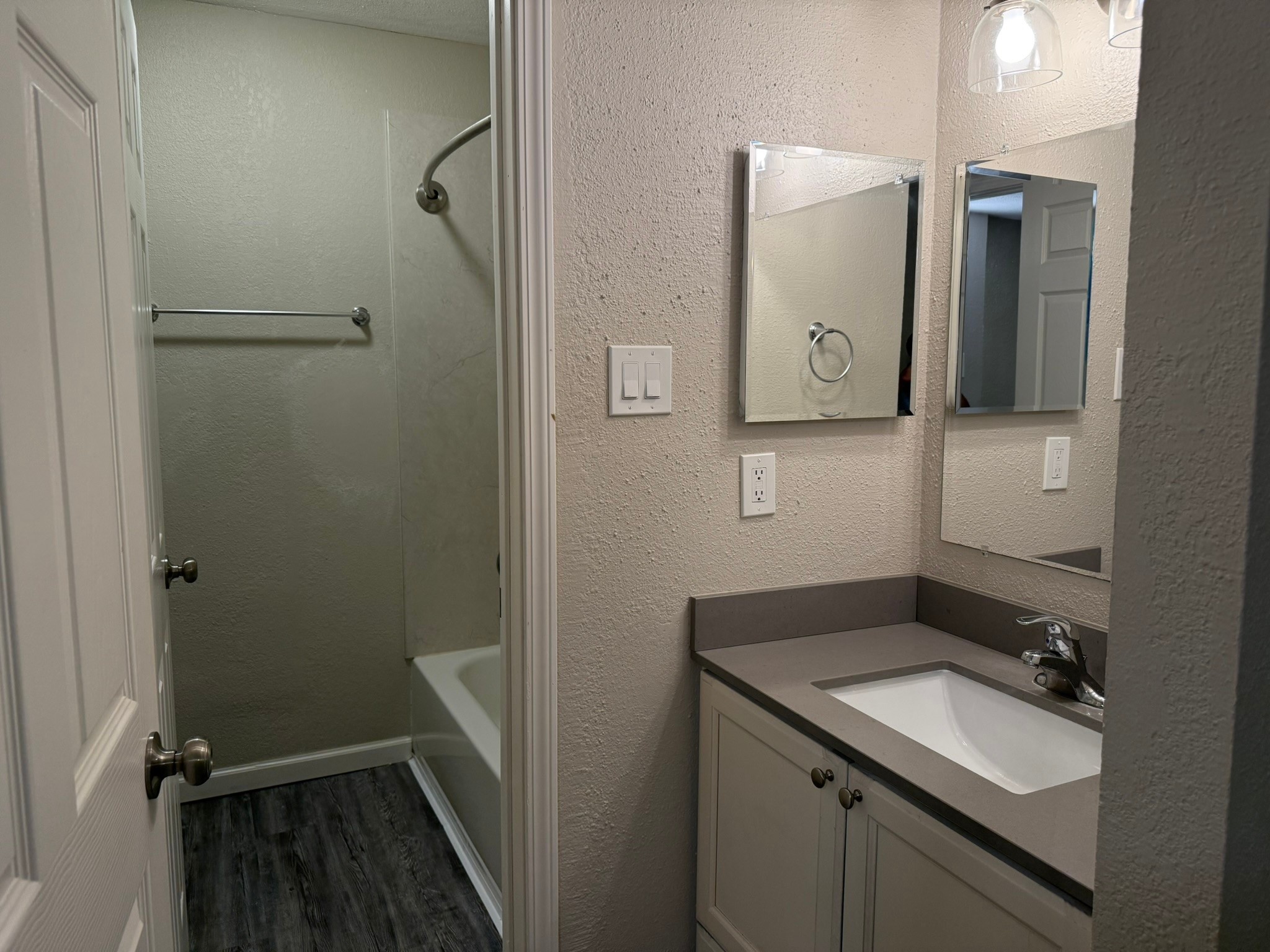 16303 Lyons School Road, Unit 907 Spring, TX 77379 - Photo 14 of 21 a bathroom with a shower sink vanity and mirror