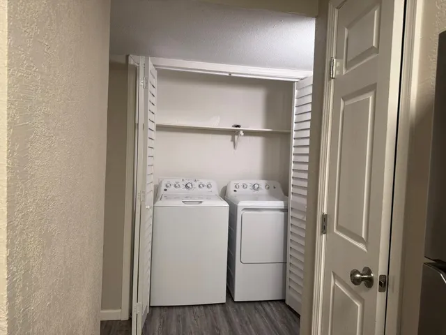a utility room with dryer and washer