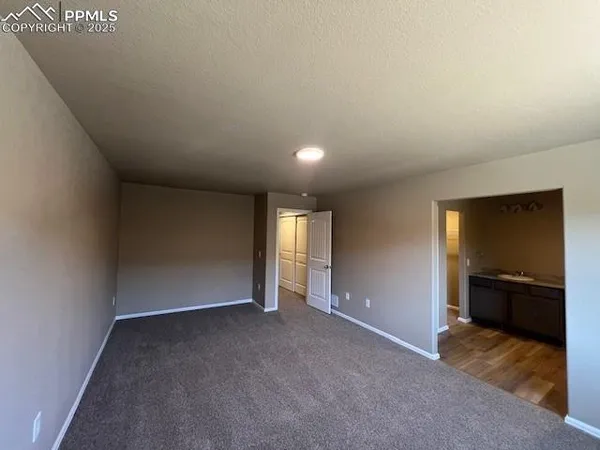 a view of a bathroom from a corridor