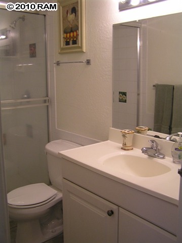 715 South Kihei Road, Unit 226 Kihei, HI 96753 - Photo 15 of 26 a bathroom with a sink a toilet and shower