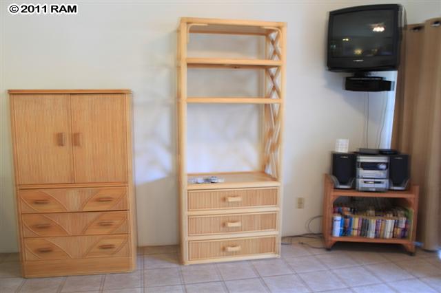 715 South Kihei Road, Unit 226 Kihei, HI 96753 - Photo 9 of 26 a view of walk in closet with clothes and shoes