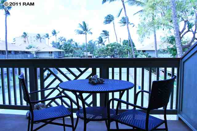 715 South Kihei Road, Unit 226 Kihei, HI 96753 - Photo 10 of 26 a view of a dining room with furniture and wooden floor