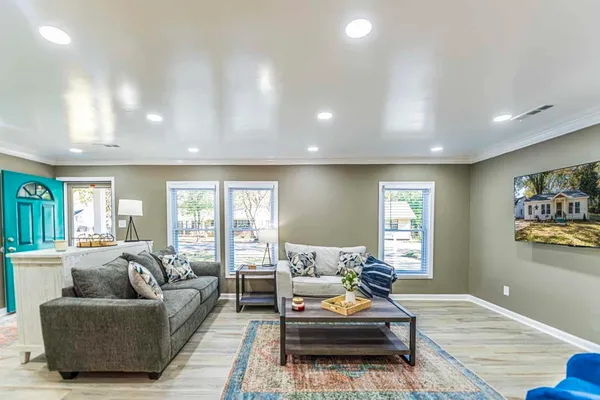 a living room with furniture and a large window