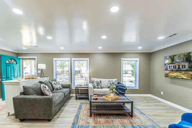 a living room with furniture and a large window