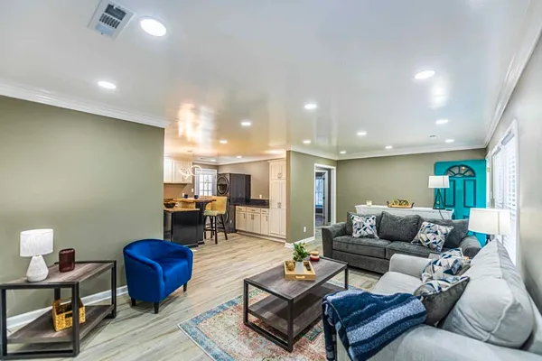 a living room with furniture and a table