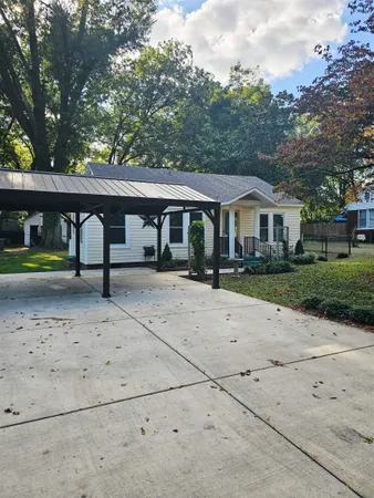 a front view of a house with garden