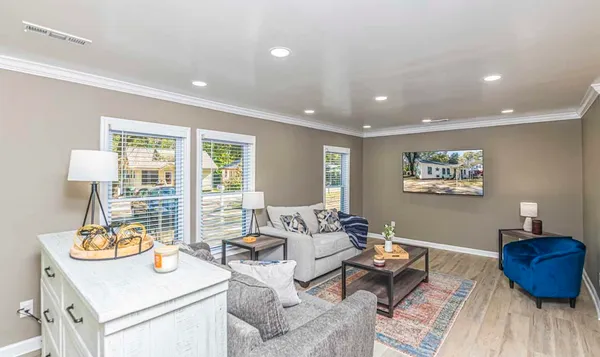 a living room with furniture and a window