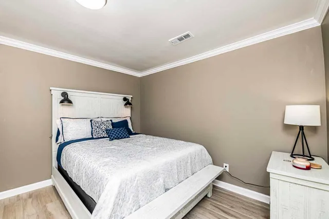 a bedroom with a bed and a table