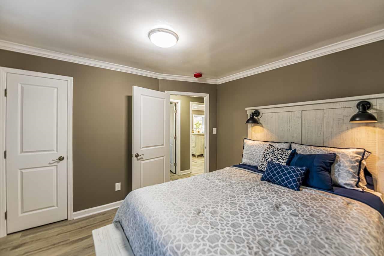 715 South Maple Street Covington, TN 38019 - Photo 30 of 33 a bed room with a bed and a closet