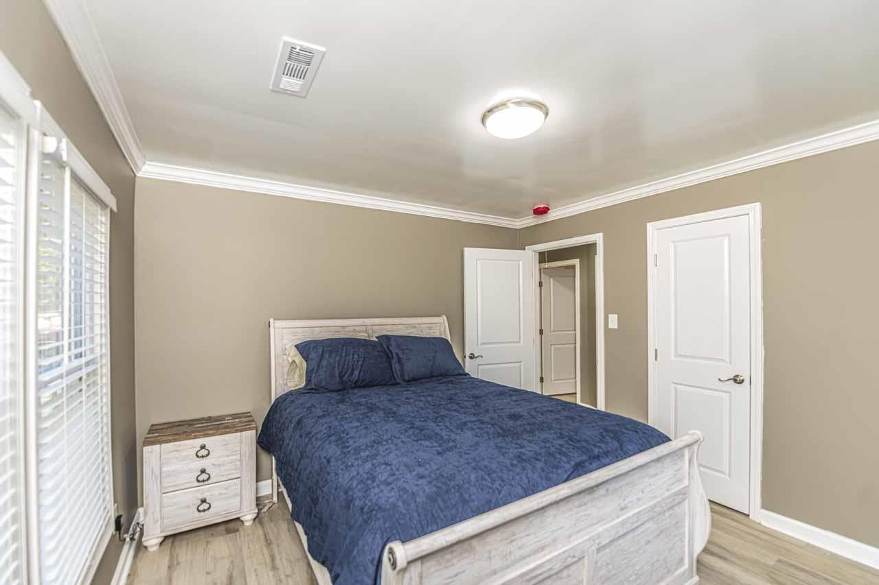 715 South Maple Street Covington, TN 38019 - Photo 32 of 33 a bedroom with a bed and a window