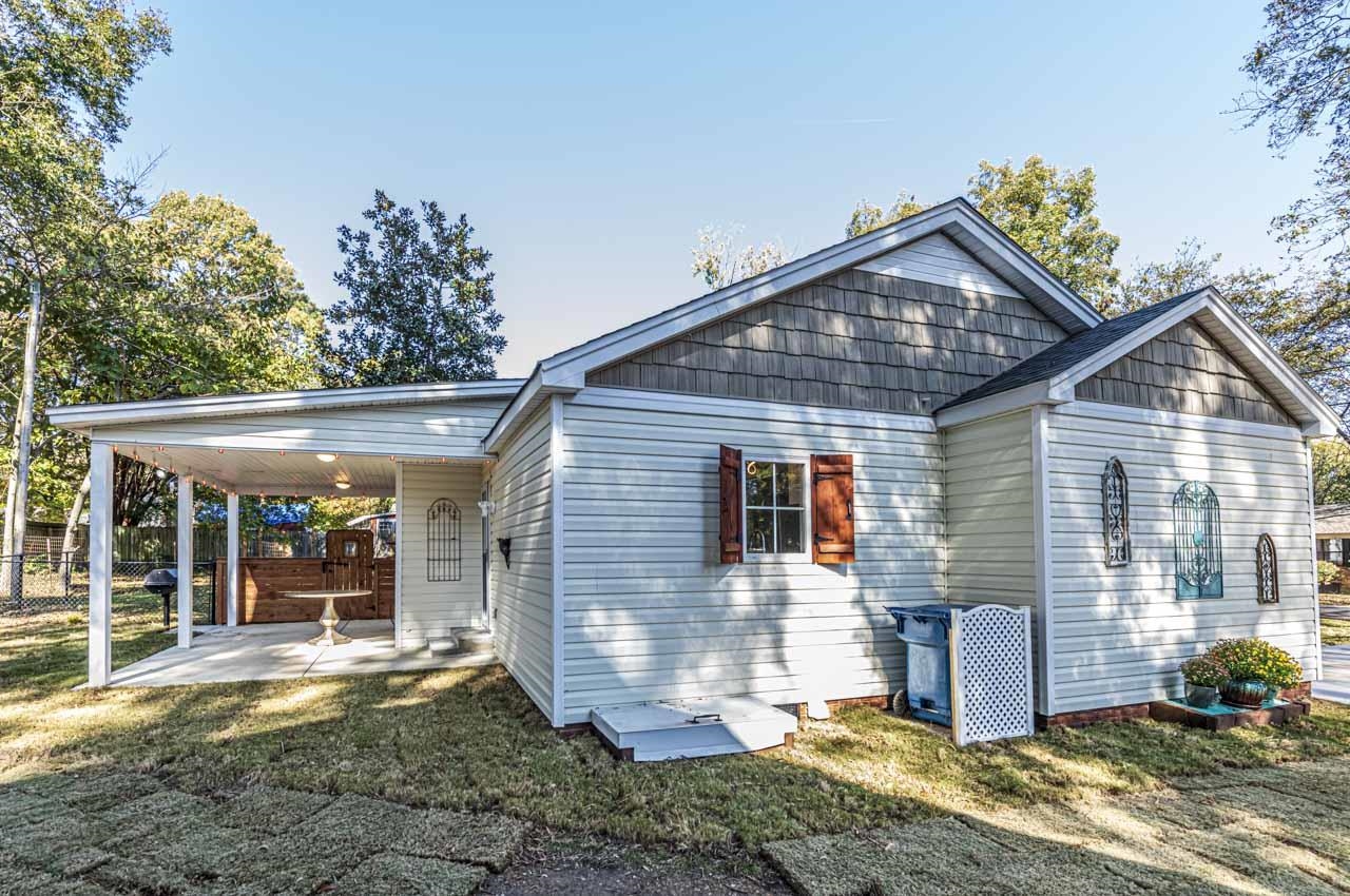 715 South Maple Street Covington, TN 38019 - Photo 5 of 33 a view of a house with a yard and floor to ceiling window