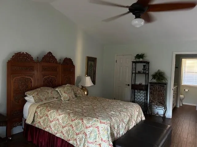 a bedroom with a bed and a walk in closet