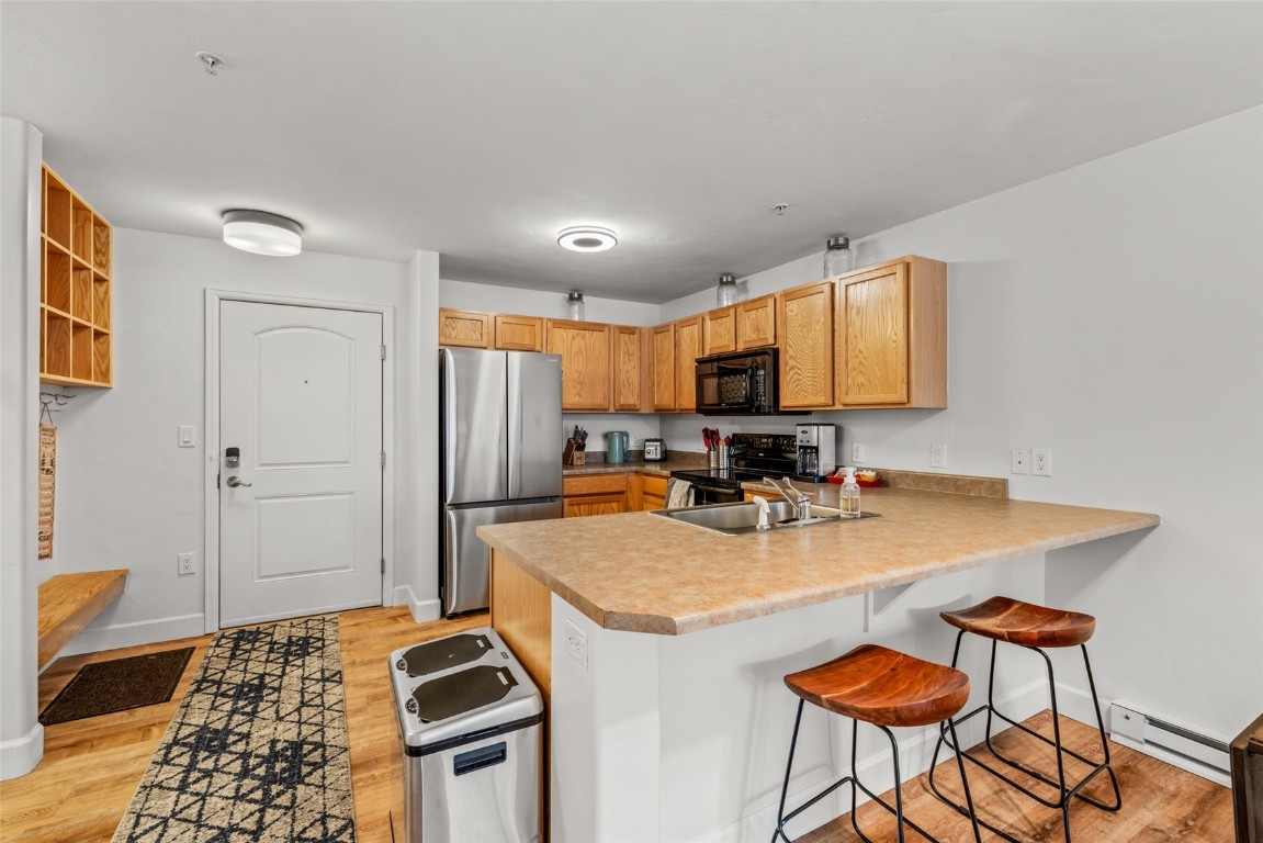 2545 Cattle Kate Circle, Unit 3207 Steamboat Springs, CO 80487 - Photo 11 of 42 a kitchen with stainless steel appliances granite countertop a sink stove and refrigerator