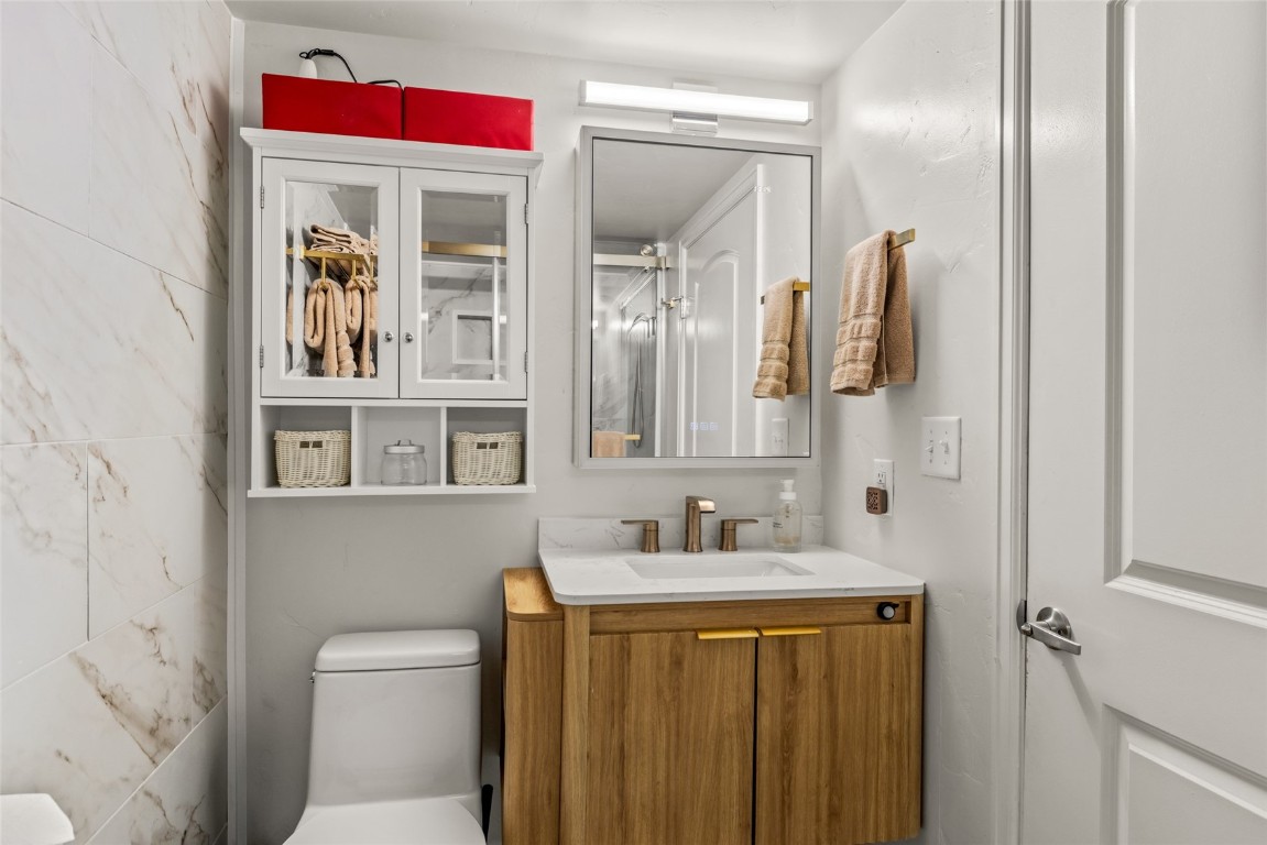 2545 Cattle Kate Circle, Unit 3207 Steamboat Springs, CO 80487 - Photo 22 of 42 a bathroom with a sink vanity mirror and toilet
