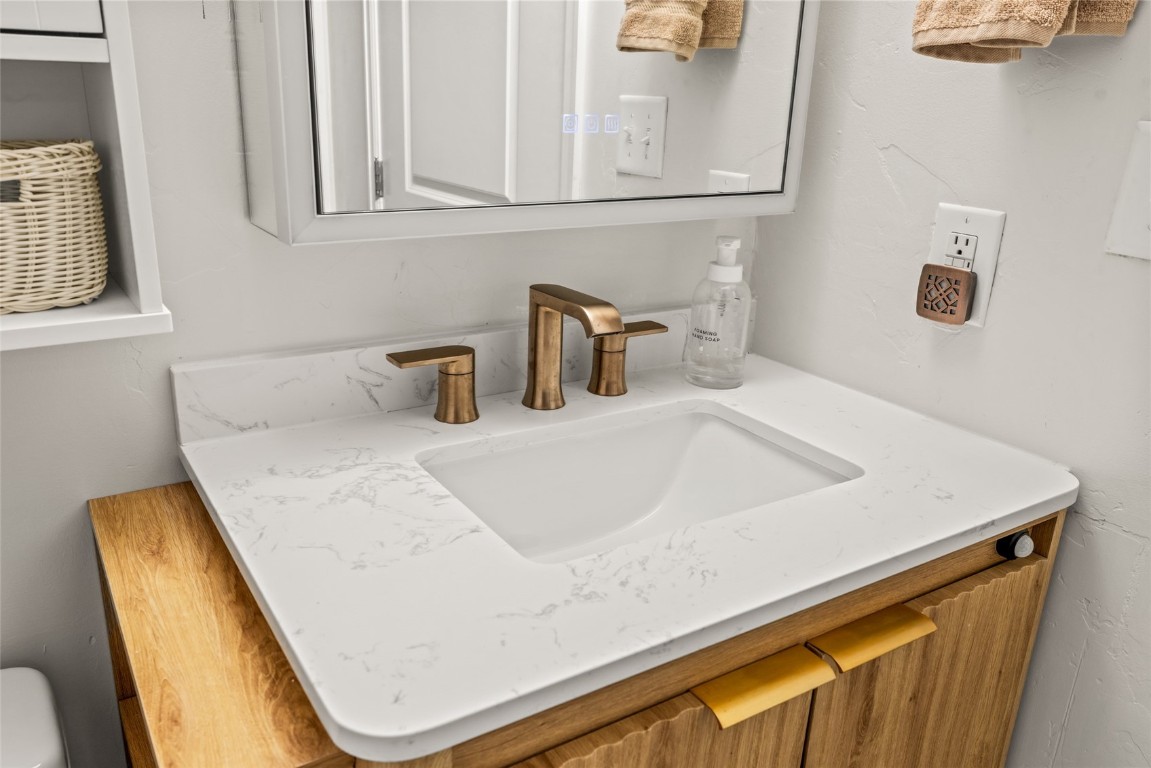 2545 Cattle Kate Circle, Unit 3207 Steamboat Springs, CO 80487 - Photo 23 of 42 a bathroom with a sink and a mirror