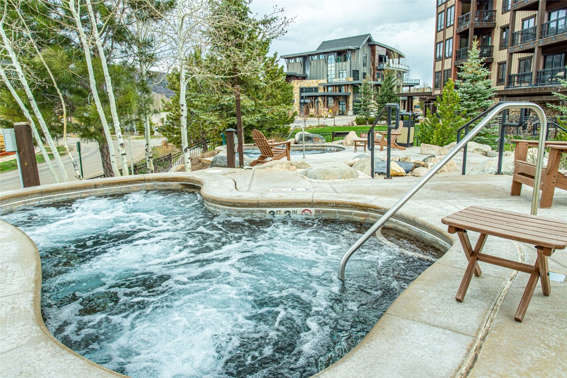 2545 Cattle Kate Circle, Unit 3207 Steamboat Springs, CO 80487 - Photo 30 of 42 a view of a swimming pool with a patio