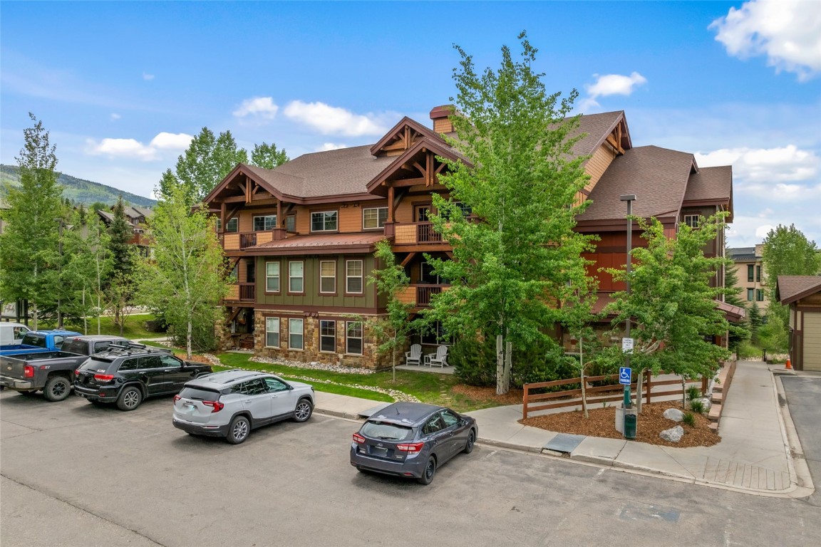 2545 Cattle Kate Circle, Unit 3207 Steamboat Springs, CO 80487 - Photo 3 of 42 a view of a cars park in front of a house