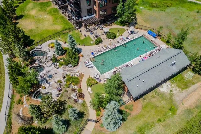 an aerial view of a house with a yard and garden