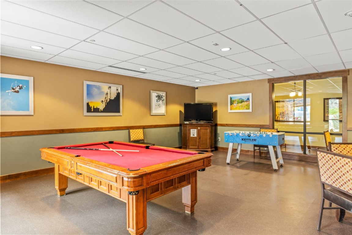 2545 Cattle Kate Circle, Unit 3207 Steamboat Springs, CO 80487 - Photo 37 of 42 a living room with pool table and pool table