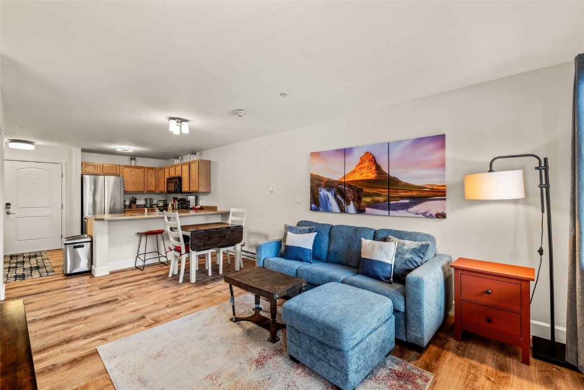2545 Cattle Kate Circle, Unit 3207 Steamboat Springs, CO 80487 - Photo 7 of 42 a living room with furniture and a kitchen view