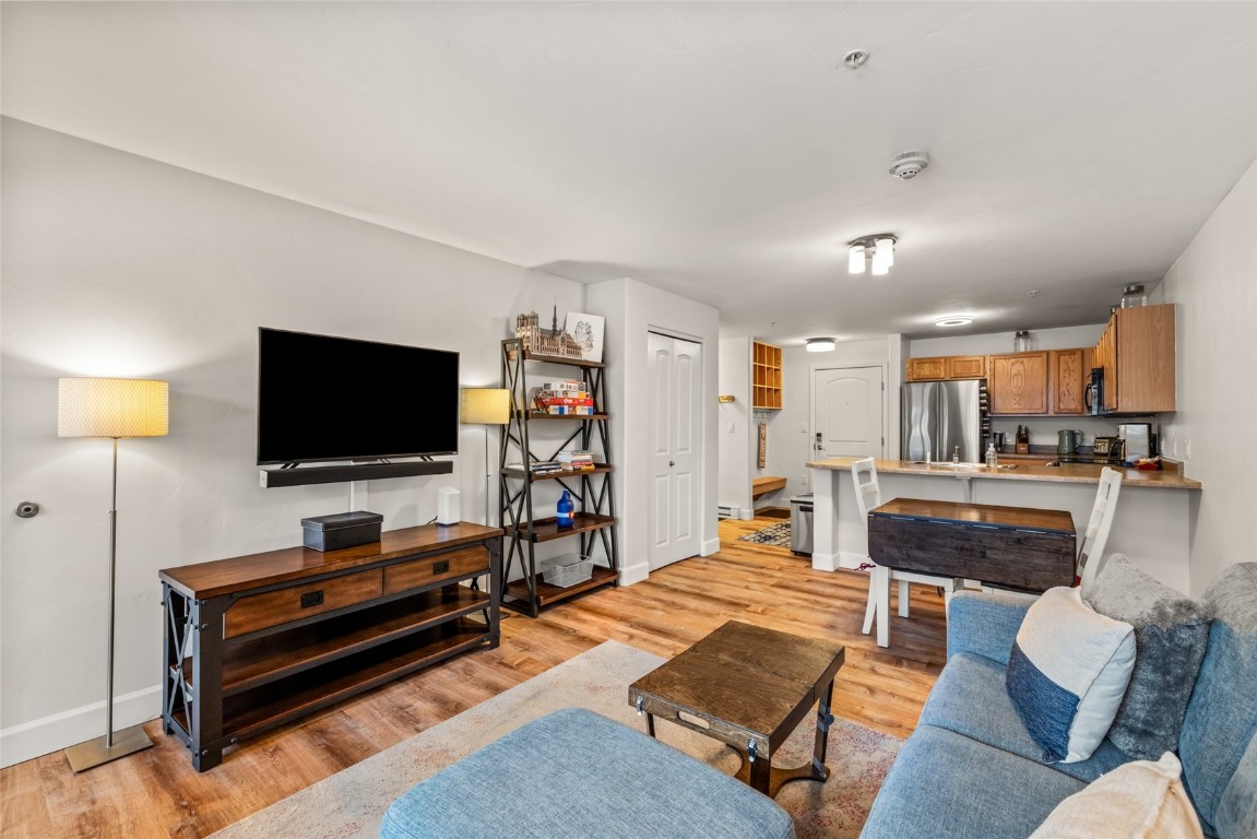 2545 Cattle Kate Circle, Unit 3207 Steamboat Springs, CO 80487 - Photo 8 of 42 a living room with furniture and a flat screen tv