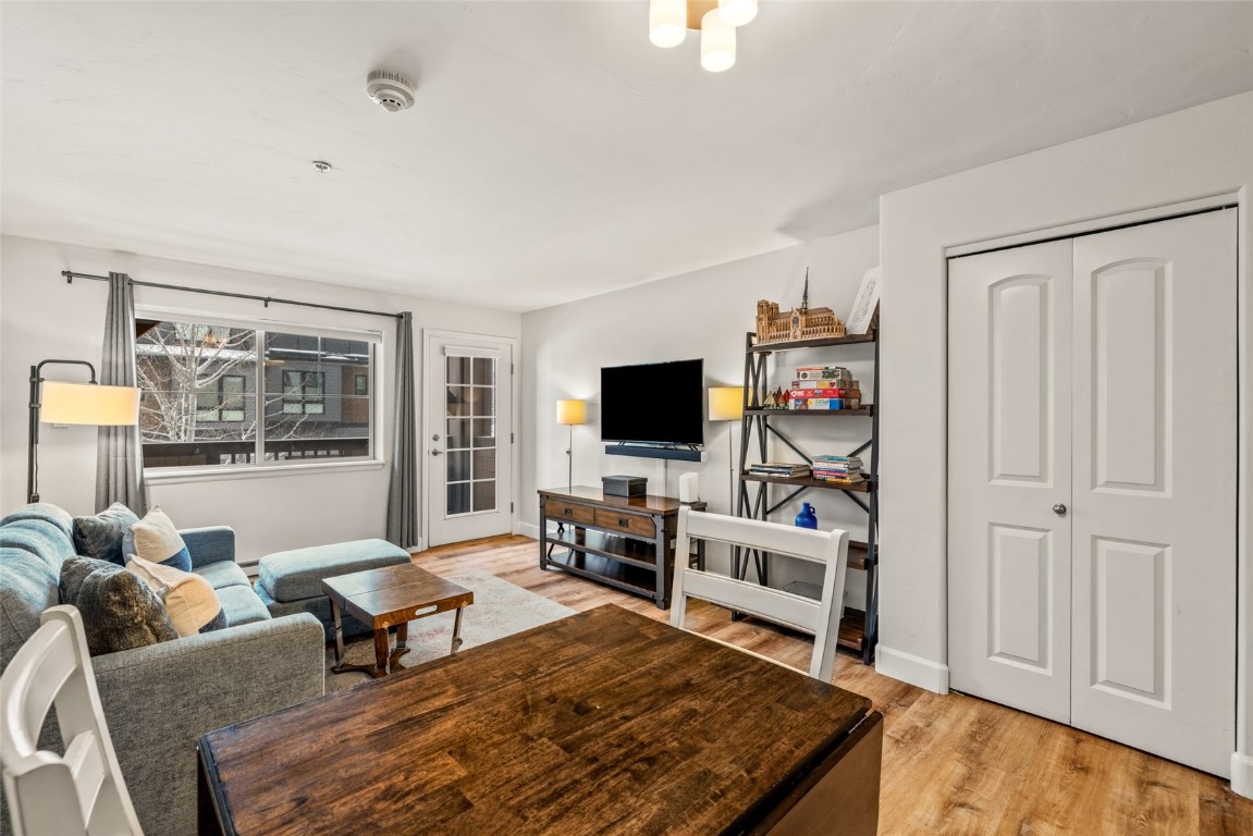 2545 Cattle Kate Circle, Unit 3207 Steamboat Springs, CO 80487 - Photo 9 of 42 a living room with furniture a flat screen tv and a rug