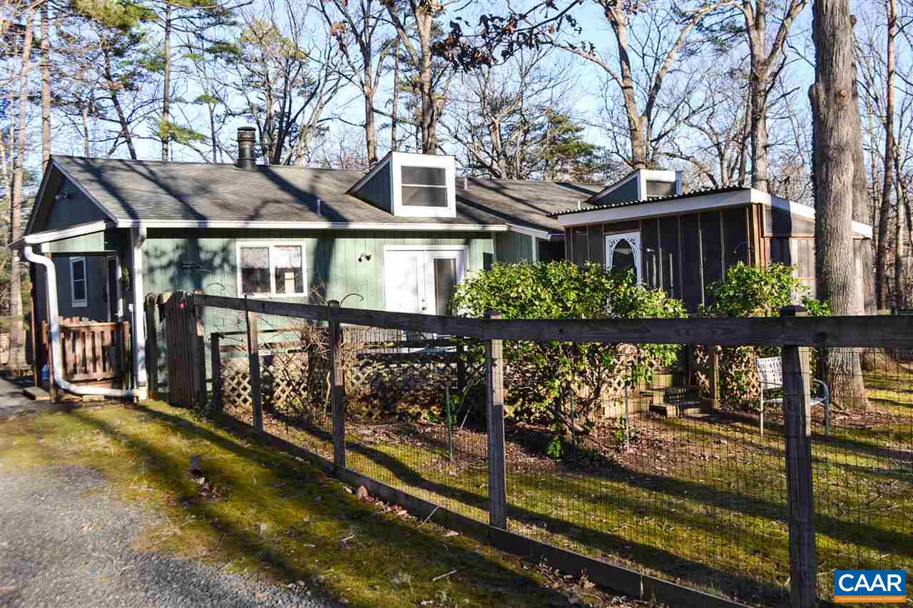 2738 Rio Mills Road Earlysville, VA 22936 - Photo 12 of 48 a front view of a house with a garden
